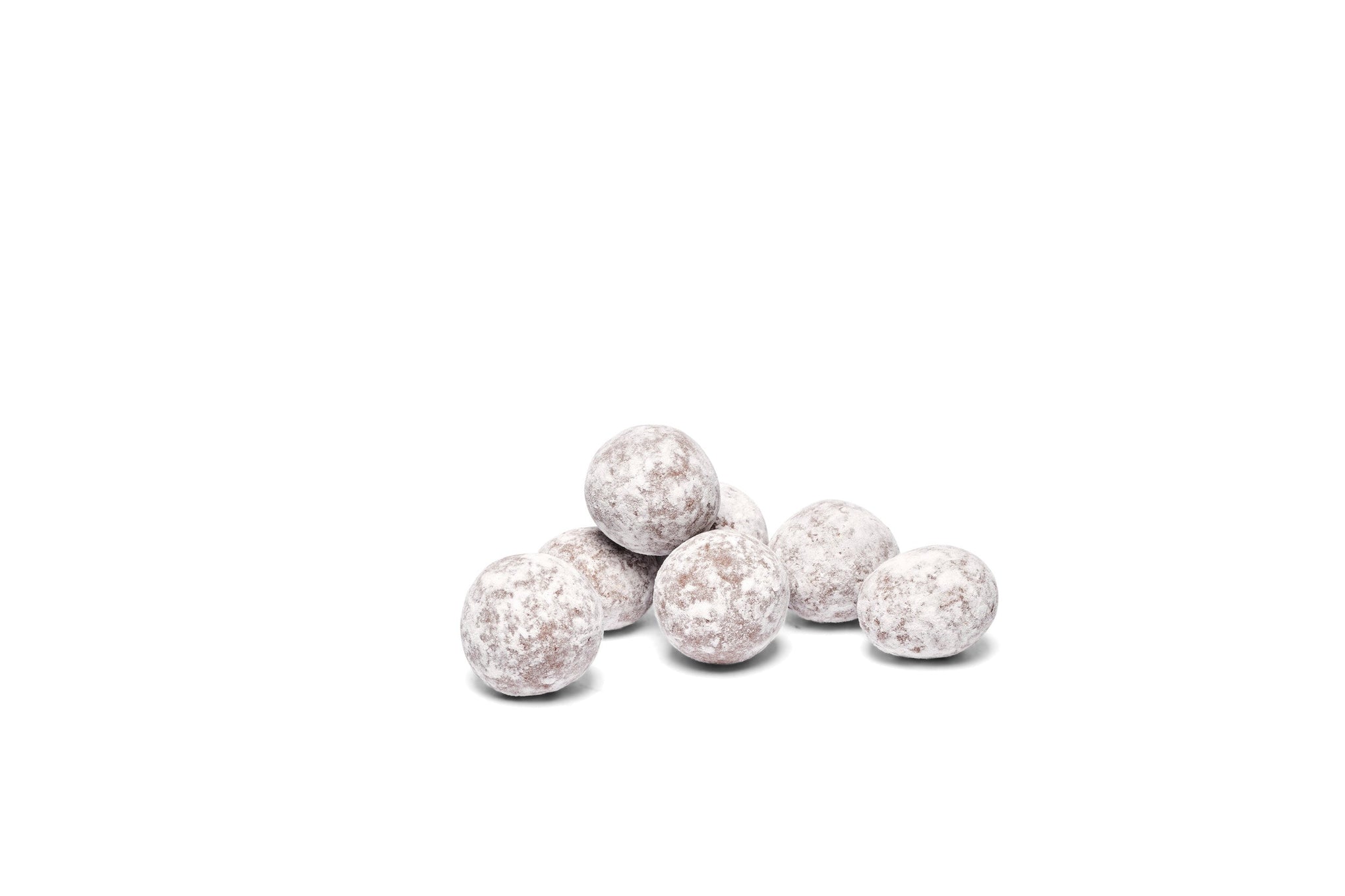 Chocolate dusted hazelnuts placed together